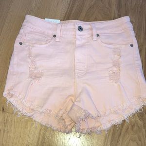 Pink ripped high rise cut off shorts